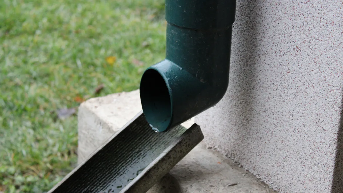 Downspout extension directing water from foundation